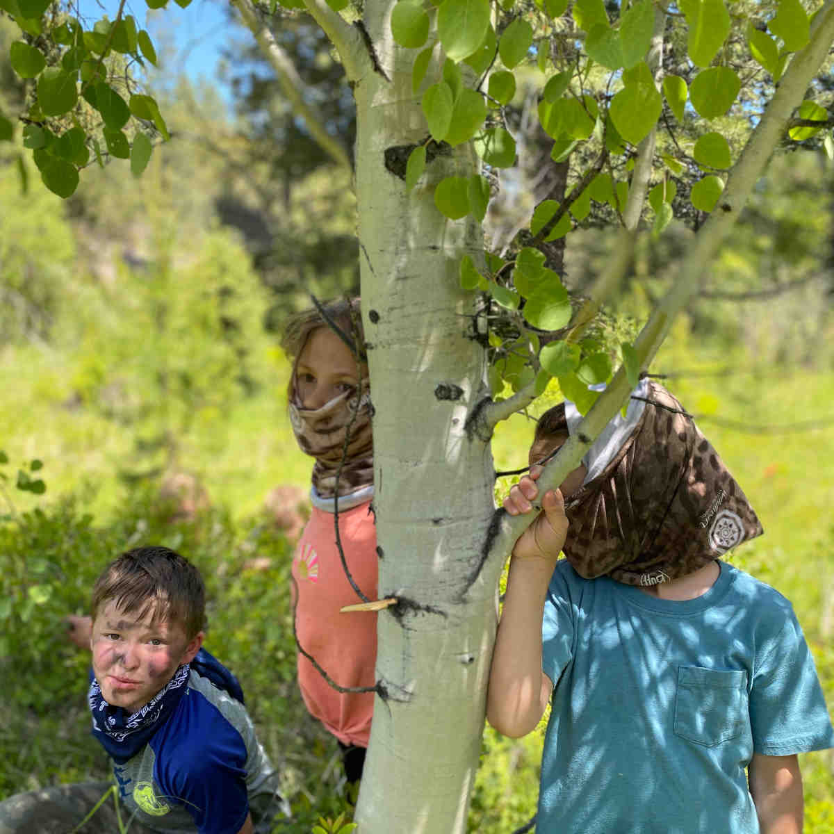 Camouflaged kids at Wildheart Nature School