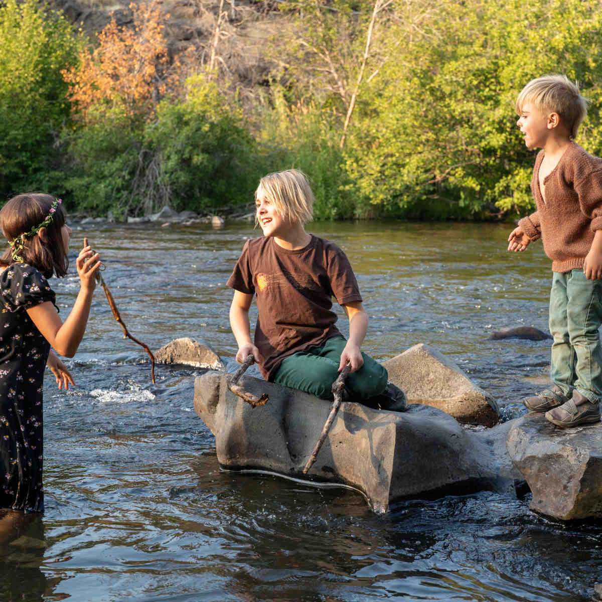 Kids in river at summer camp in Bend, Oregon